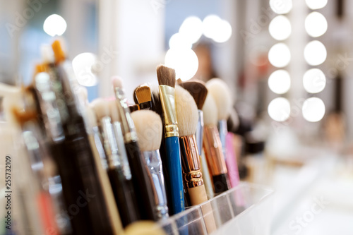 Close up of makeup brushes on desk. Selective focus on brushes.