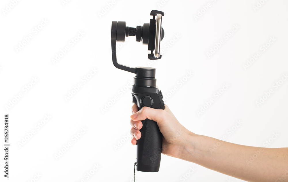 woman hand and gimbal with phone on white background woman hand and gimbal with phone on white background