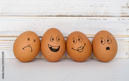Brown eggs with cute hand drawn funny faces.