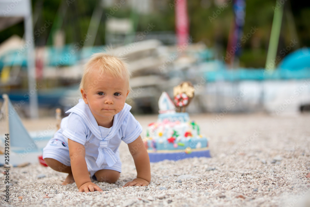 Sweet baby boy, celebrating on the beach first birthday with sea theme cake Sweet baby boy, celebrating on the beach first birthday with sea theme cake