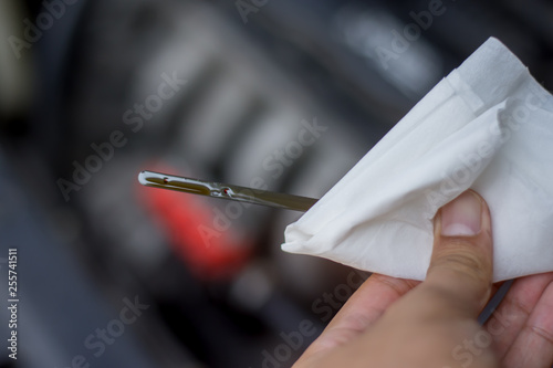 Close up  of oil gauge with blur engine on background