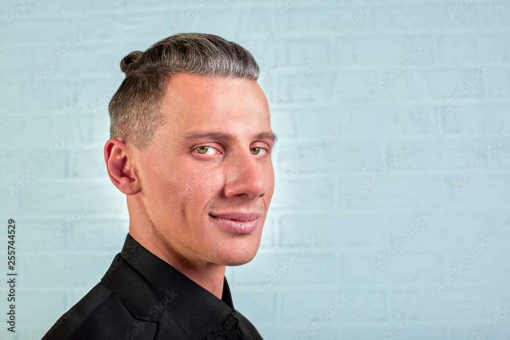closeup portrait young handsome businessman standing on brick wall background closeup portrait young handsome businessman standing on brick wall background