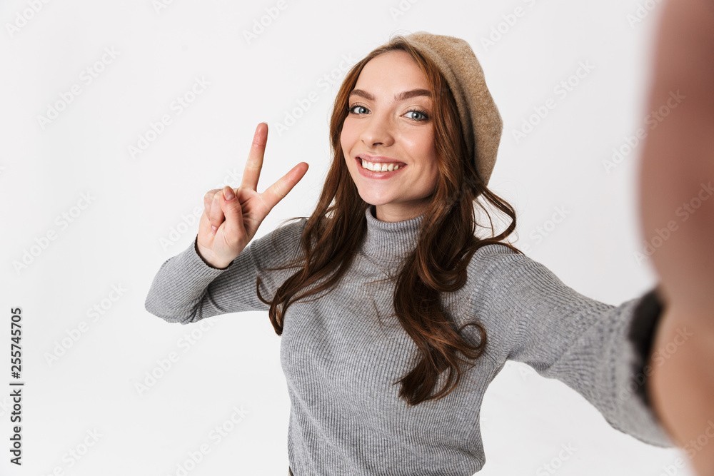 Cheerful young woman standing isolated Cheerful young woman standing isolated