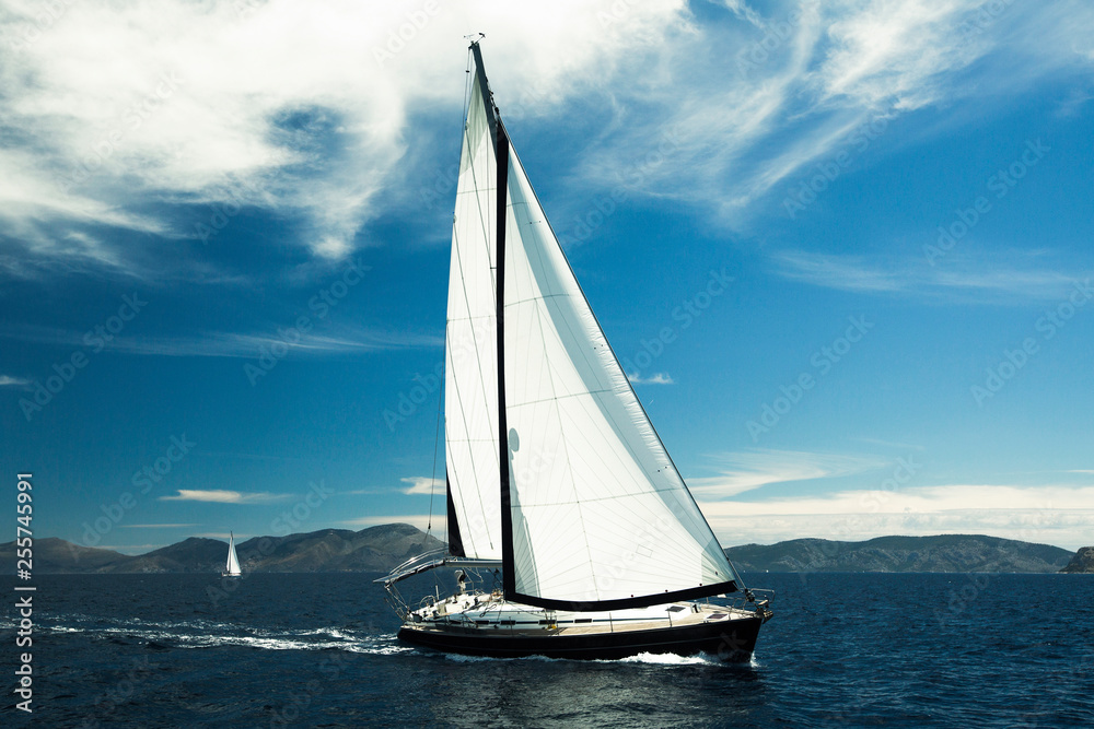 Sailing yacht boat in the Sea. Luxury Yachts for vacation.
