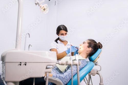 Dentist treating teeth in the clinic