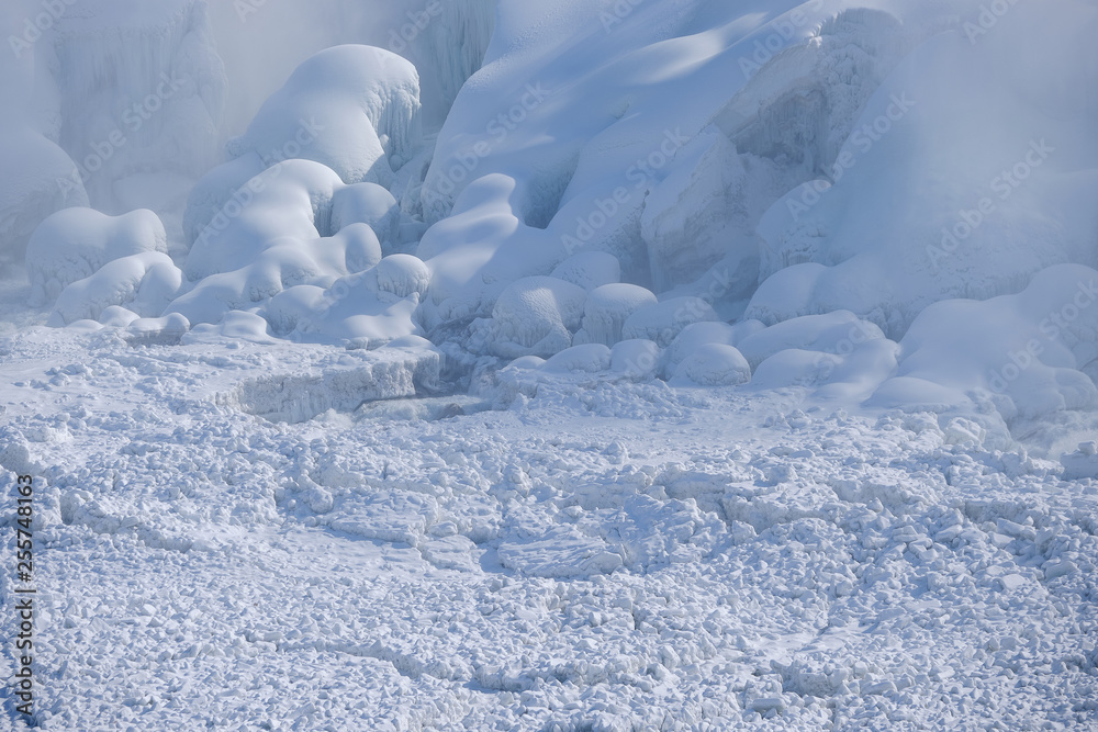 Ice floes and frozen water and rocks at the bottom of Niagara Falls Ontario Canada