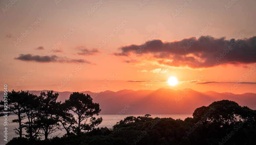 Sunrise at Sao Jorge Island, seen from Pico island at the Azores, Portugal