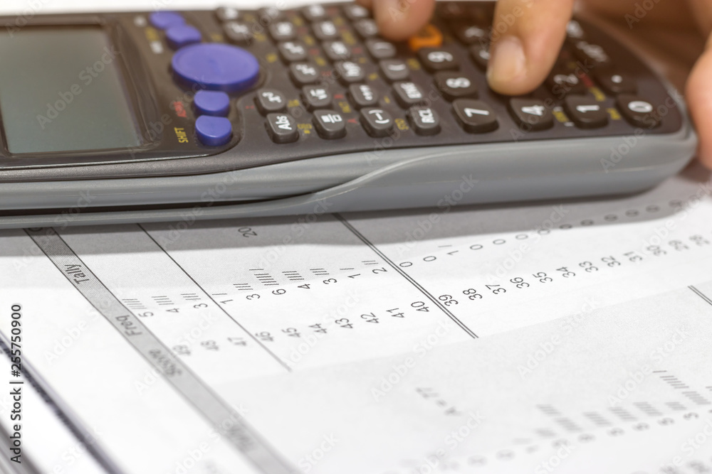 Using calculator calculate numerical value of final grade for each course at the end of semester. The number of grade points a student earned in a given period of time. Grading in education concept. Using calculator calculate numerical value of final grade for each course at the end of semester. The number of grade points a student earned in a given period of time. Grading in education concept.