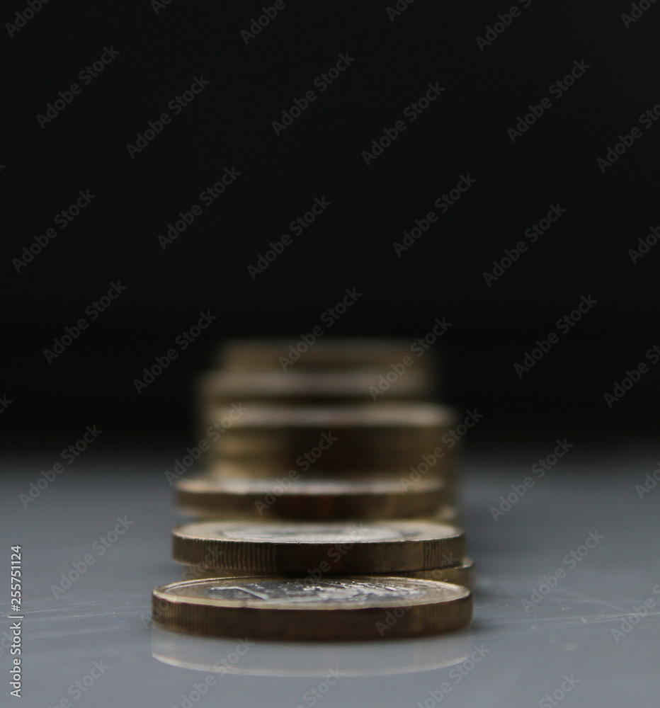 Euros stacked in piles and becoming blurry Euros stacked in piles and becoming blurry