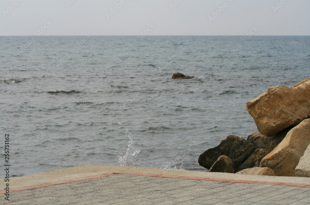 View of the Mediterranean sea from an empty stone pathway on Limassol seafront 