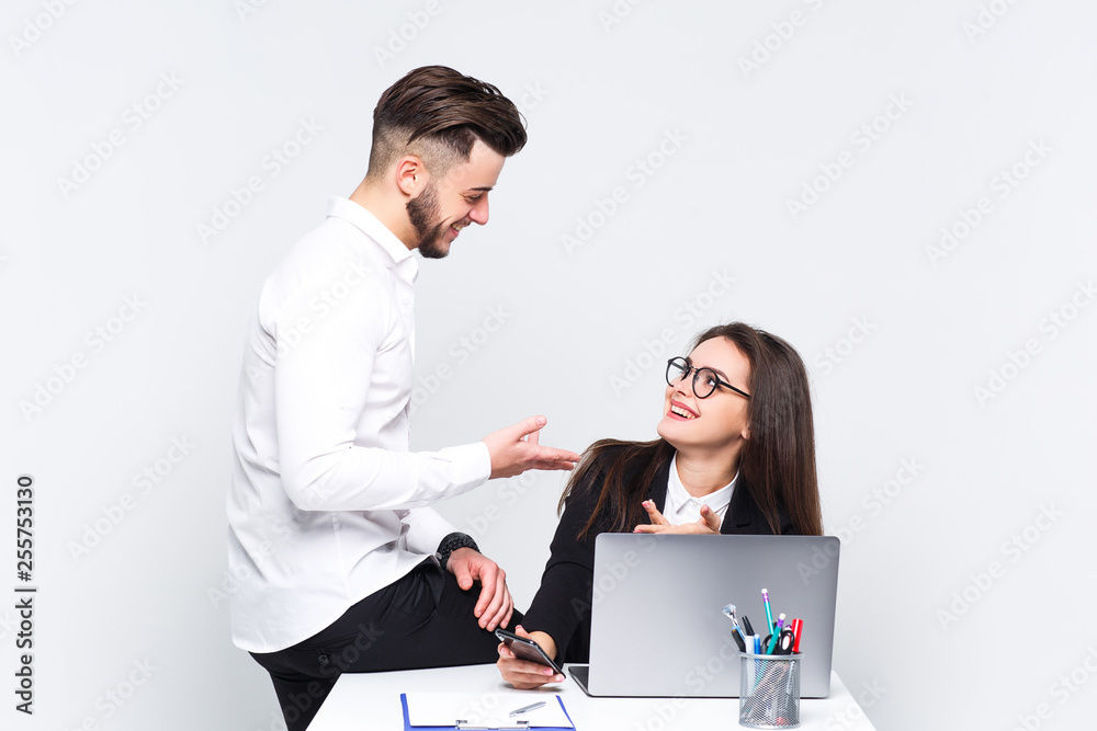 Two young employee work with new business plan. They are very happy. White background. Two young employee work with new business plan. They are very happy. White background.