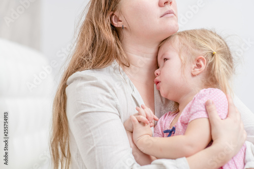 Mother calming her crying baby girl