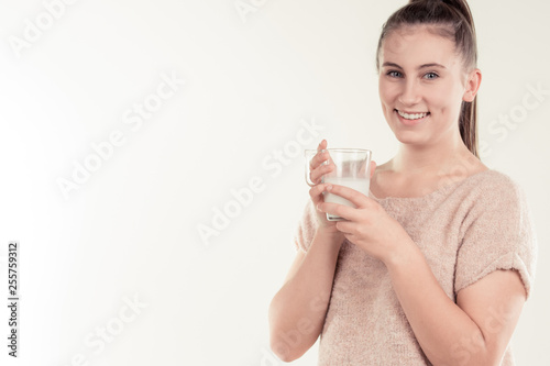 girl drinks milk and is happy