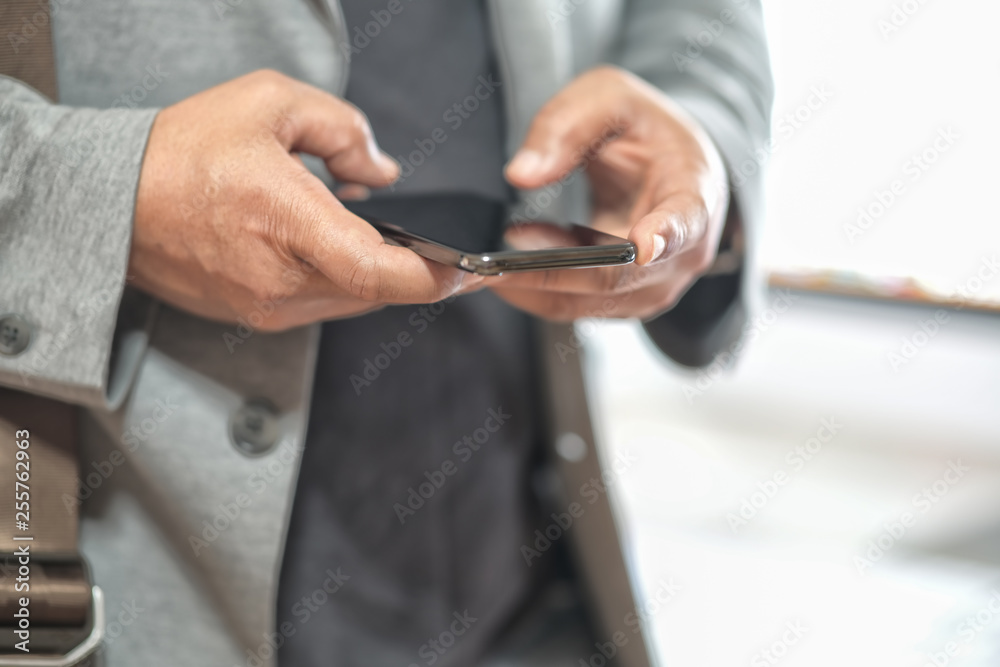 Man's hand using cellphone Man's hand using cellphone