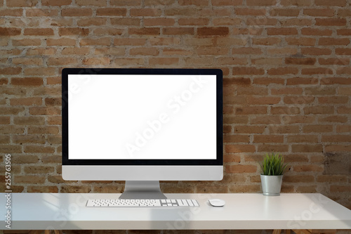 Mock up blank screen desktop computer on the white desk