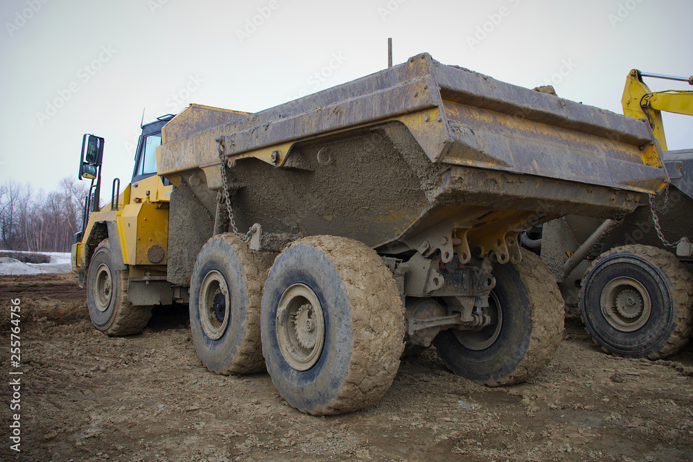 truck lorry tipper yellow big equipment construction site working
