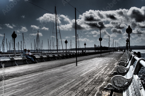 Friends chatting on old promenade