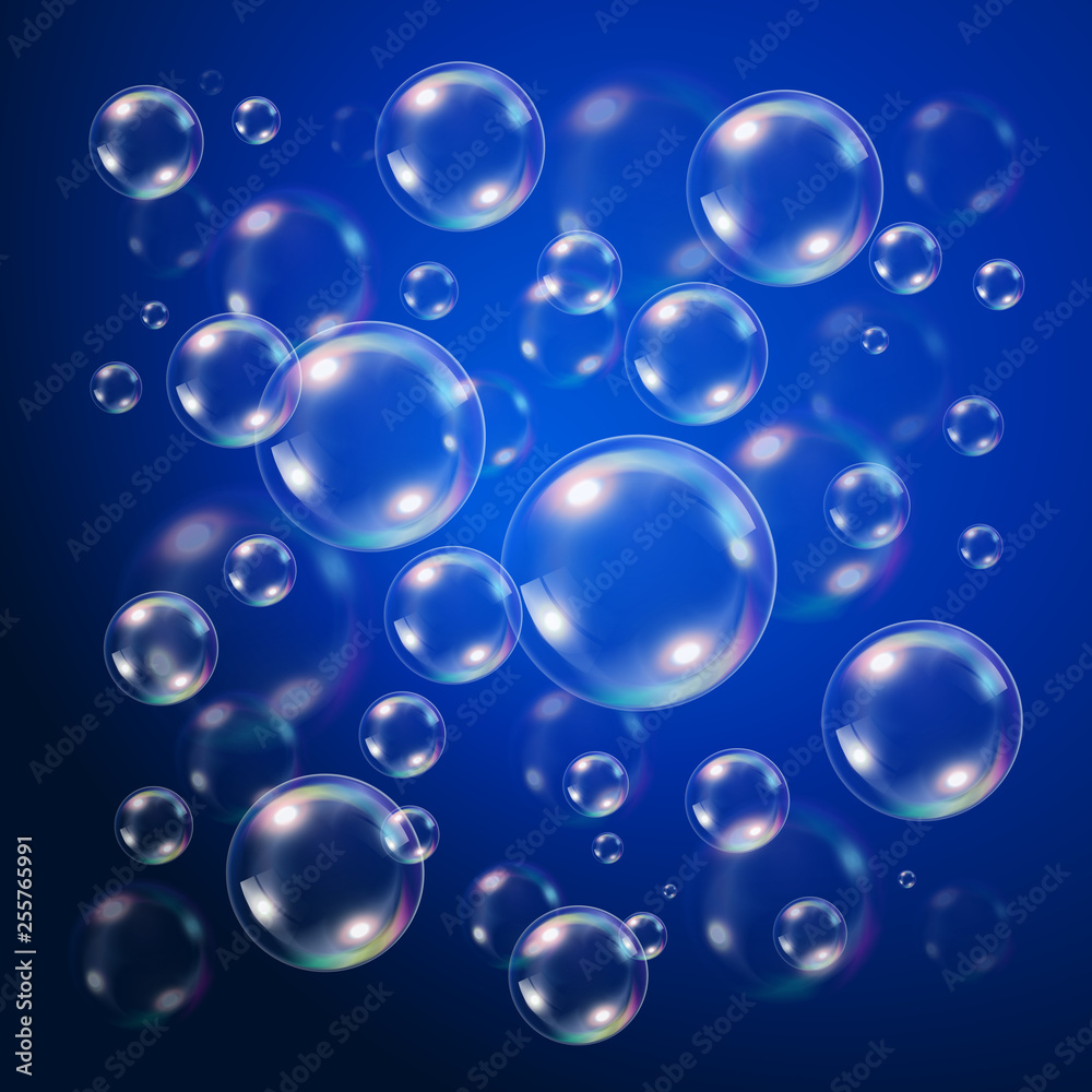 Transparent bubbles over dark blue