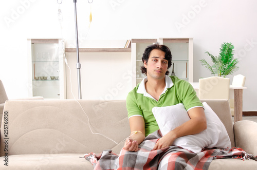 Young man suffering at home 