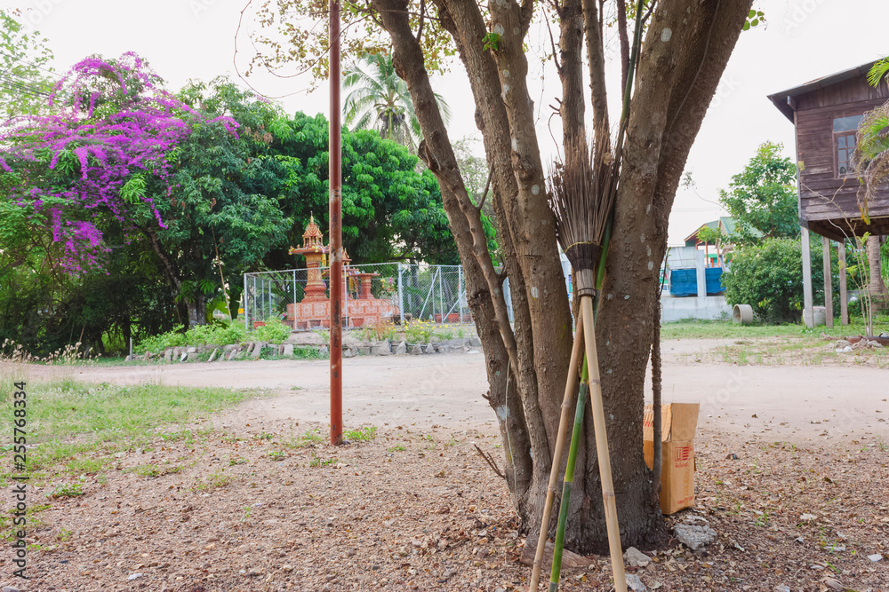 Fototapeta premium broomstick leaning under the tree