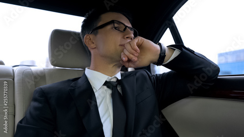Politician stuck in traffic jam, late for important meeting, big city life © motortion