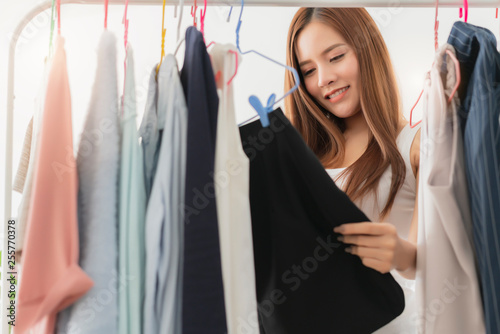 smart beautiful asian woman enjoy choose shopping cloth or shop owner business entrepreneur ideas concept