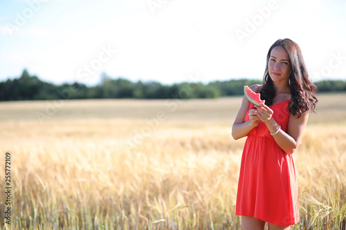 Summer landscape and a girl on nature walk in the countryside.