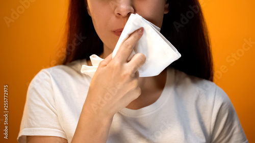 Tablou pe pânză Girl wiping face with napkin after eating, hygiene and etiquette, happy client
