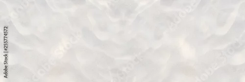 Fototapeta Sand beach texture background. Mock up and copy space. Top view. Selective focus.