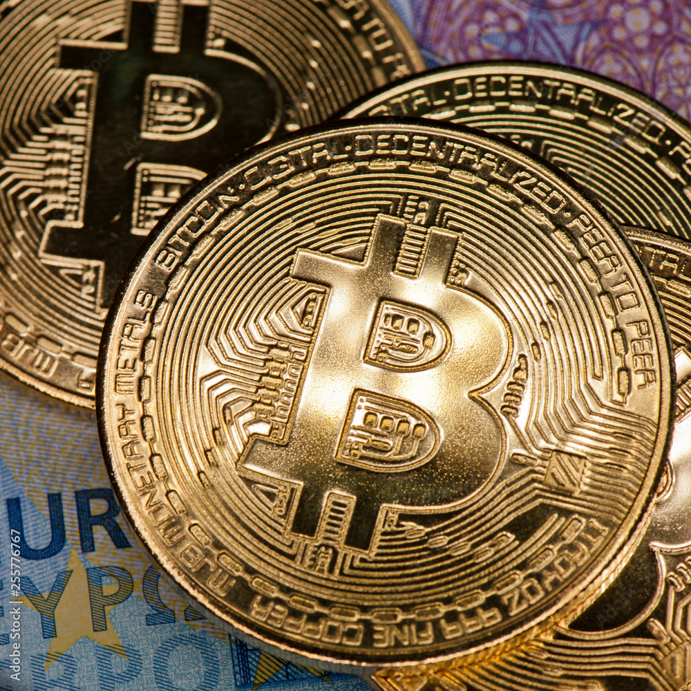 Bitcoins and 20 euro banknote. Cryptocurrency