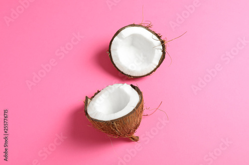 Split tropical coconut on color background, space for text