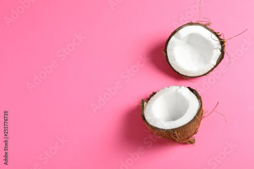 Split tropical coconut on color background, space for text
