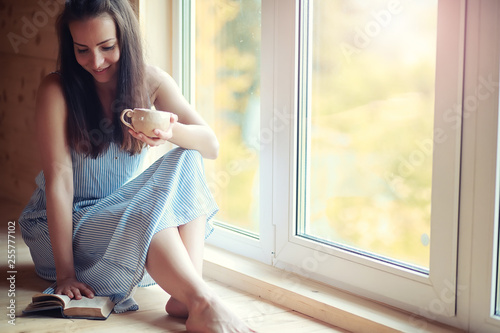 A girl at the window in the house