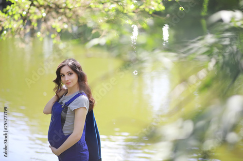 Pregnant woman on a walk in the park
