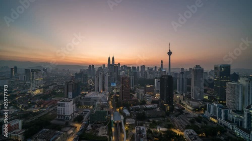 KUALA LUMPUR, MALAYSIA - MARCH 17, 2019: 4K Cinematic Sunrise Time Lapse Footage of Kuala Lumpur city skyline from the west side of the Malaysian capital.