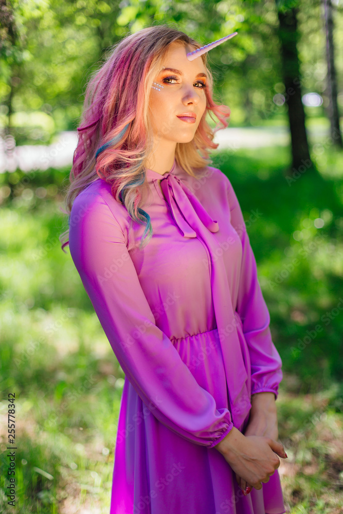 Fairy girl unicorn with pink hair in summer forest Fairy girl unicorn with pink hair in summer forest