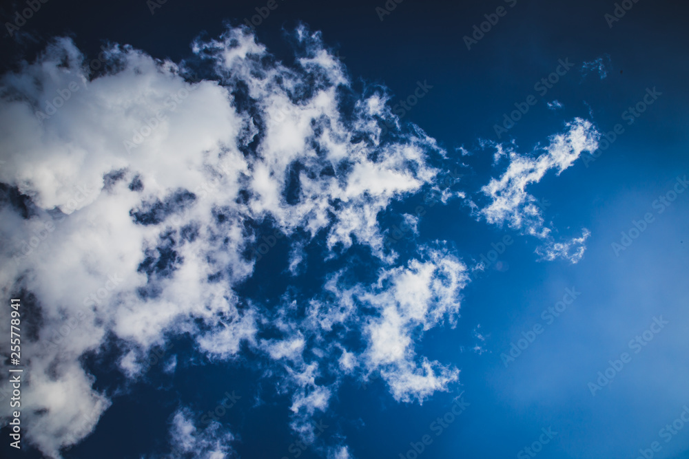 beautiful white clouds float across the blue sky beautiful white clouds float across the blue sky