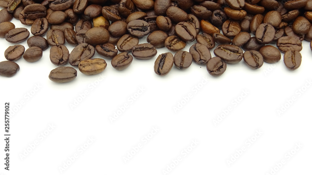 Close up of roasted coffee beans on white background Close up of roasted coffee beans on white background