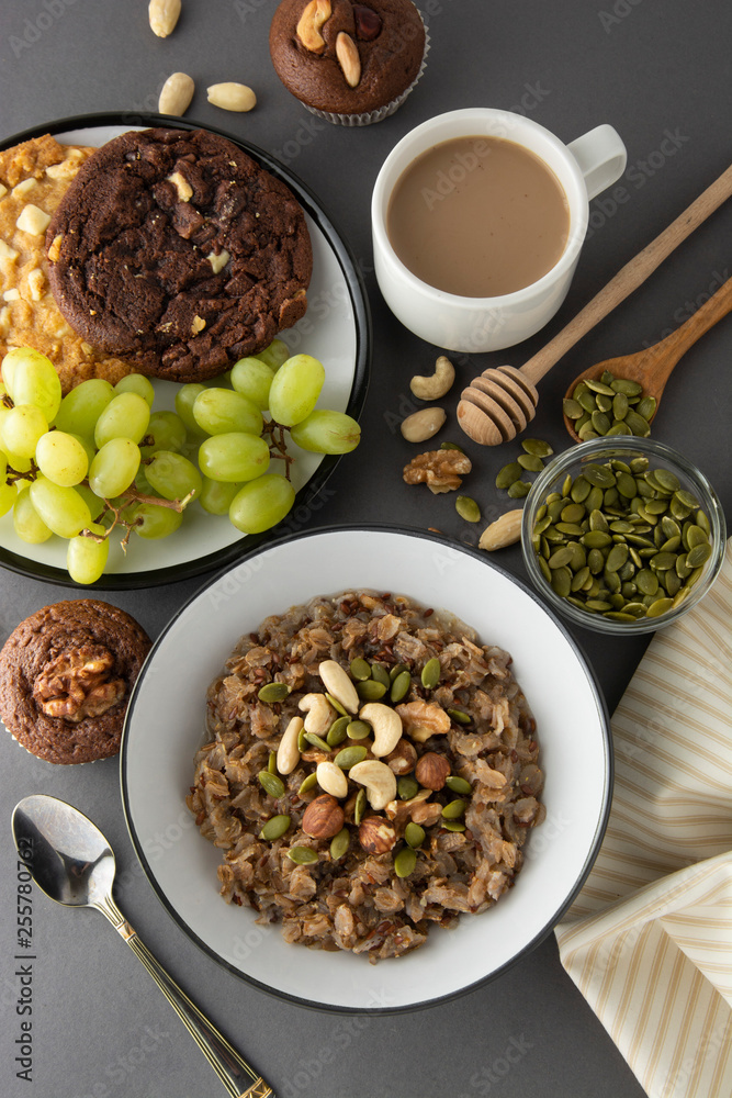 Healthy breakfast bowl. Oatmeal with nuts - walnuts, chia seeds, pumpkin seeds, honey and fresh fruits, isolated. Healthy breakfast bowl. Oatmeal with nuts - walnuts, chia seeds, pumpkin seeds, honey and fresh fruits, isolated.