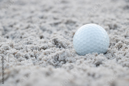Golf ball in sand trap