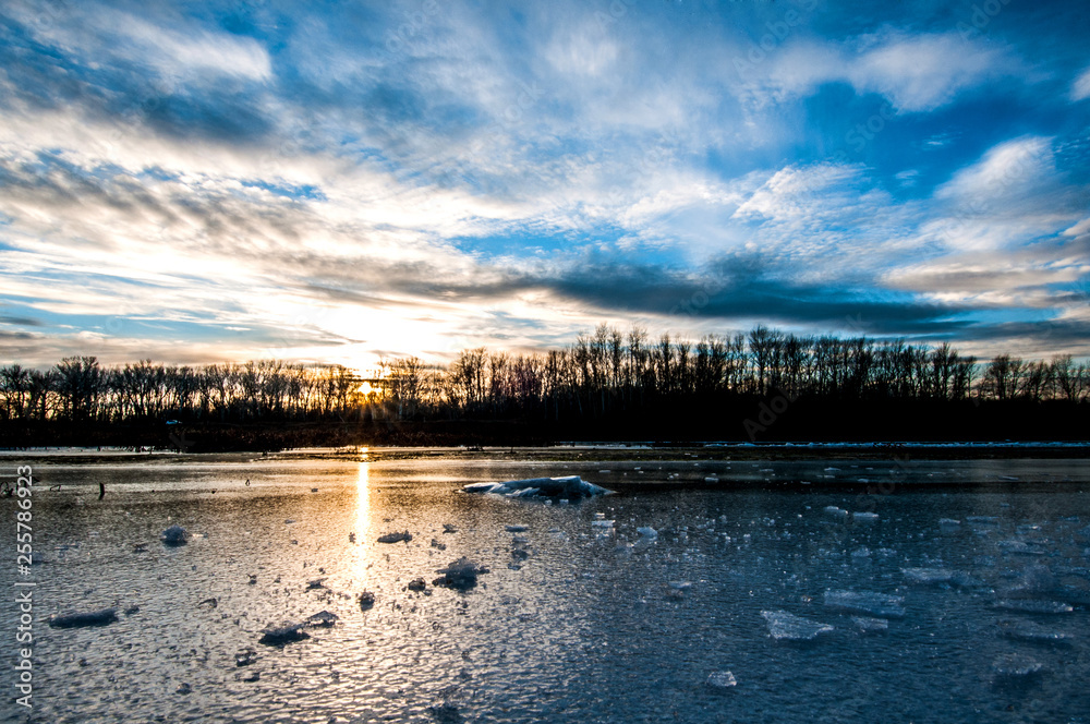 very colorful and the best sunset on the not completely frozen river-Ural