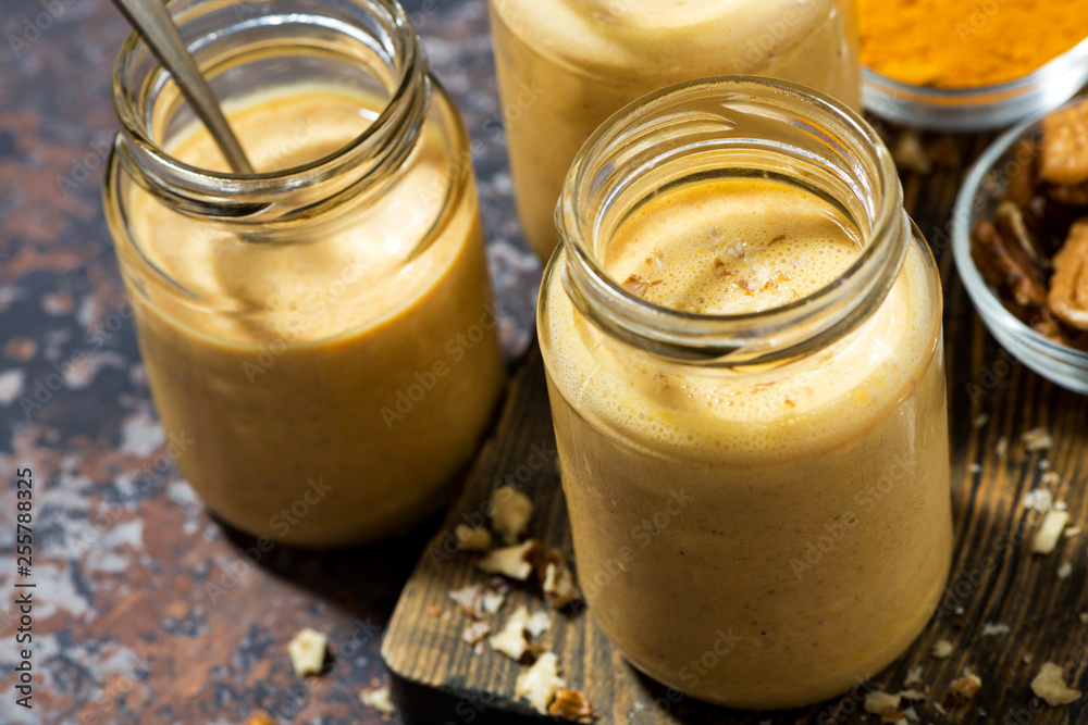 carrot smoothies with turmeric, top view carrot smoothies with turmeric, top view