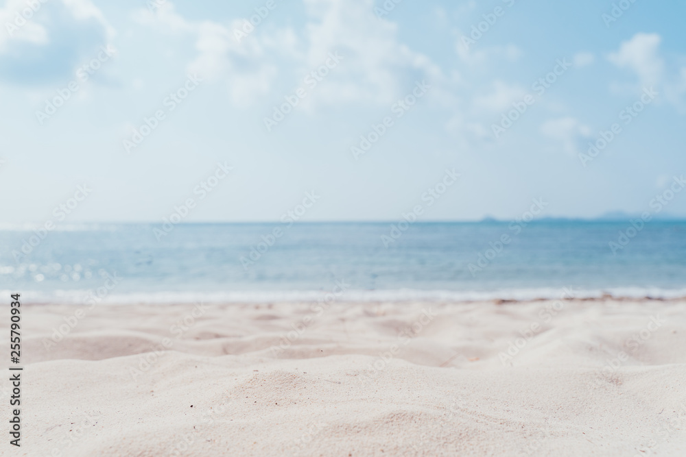 Copy space blur tropical beach with bokeh sun light wave on blue sky and white cloud abstract background. Summer vacation outdoor and travel holiday adventure concept. sea sand sky and summer day.