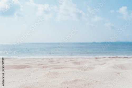 Fototapeta Naklejka Na Ścianę i Meble -  Copy space blur tropical beach with bokeh sun light wave on blue sky and white cloud abstract background. Summer vacation outdoor and travel holiday adventure concept. sea sand sky and summer day.