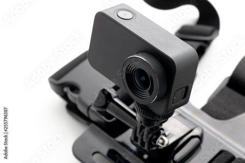Extreme action camera with chest mount isolated on a white background. Camera for footage 4k movies, sports and domestic life. for design and decoration