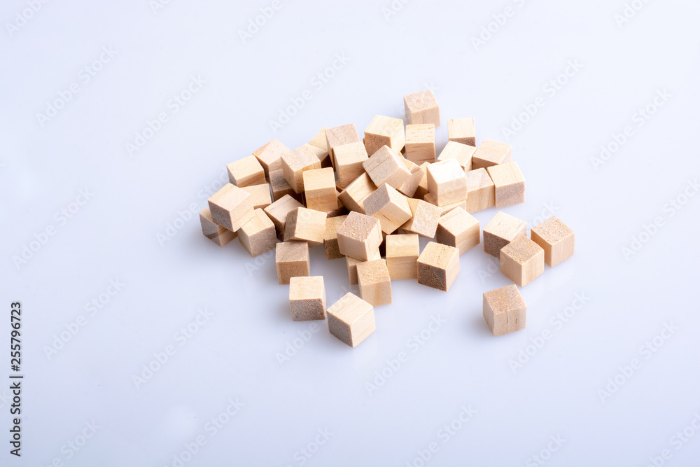 Wooden toy cubes as  educational game object on white background