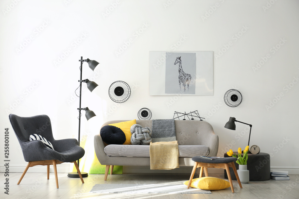 Fototapeta premium Stylish living room interior with comfortable sofa. Idea for home decor
