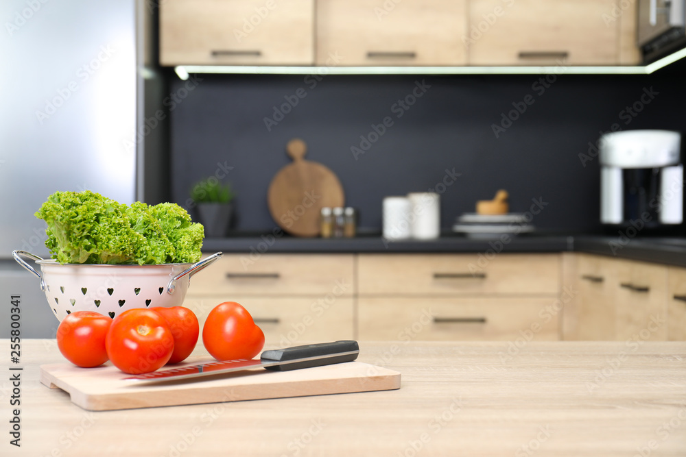 Fresh vegetables on wooden table in kitchen. Space for text Fresh vegetables on wooden table in kitchen. Space for text