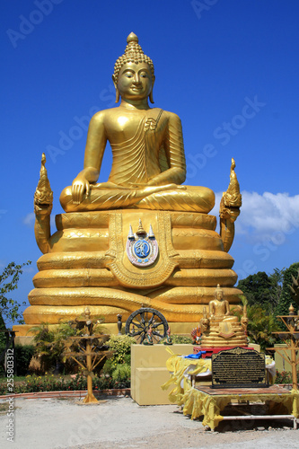 February 13, 2019. Phuket, Thailand. Golden Buddha statue near the huge sculpture of the Great white Buddha in Phuket.