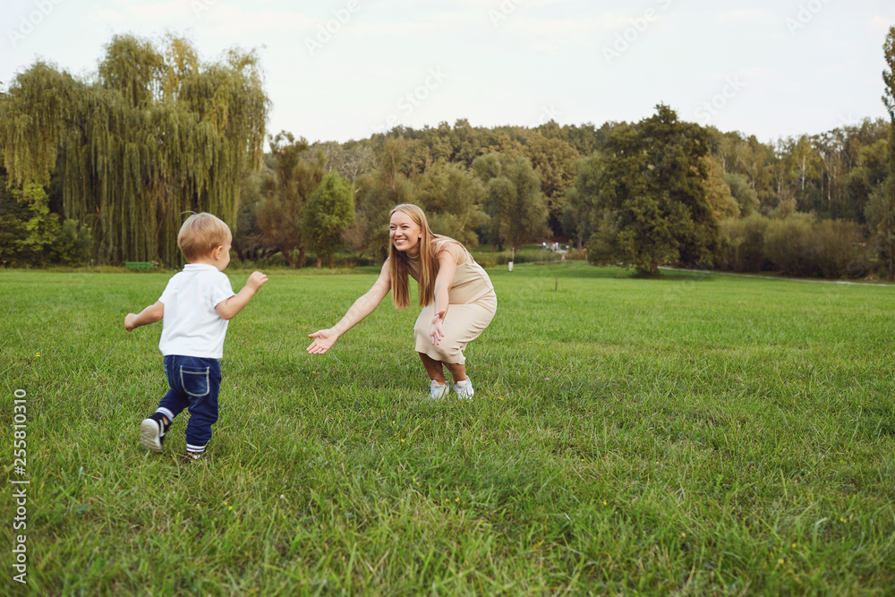 Mother with a child plays in the park. Mother with a child plays in the park.